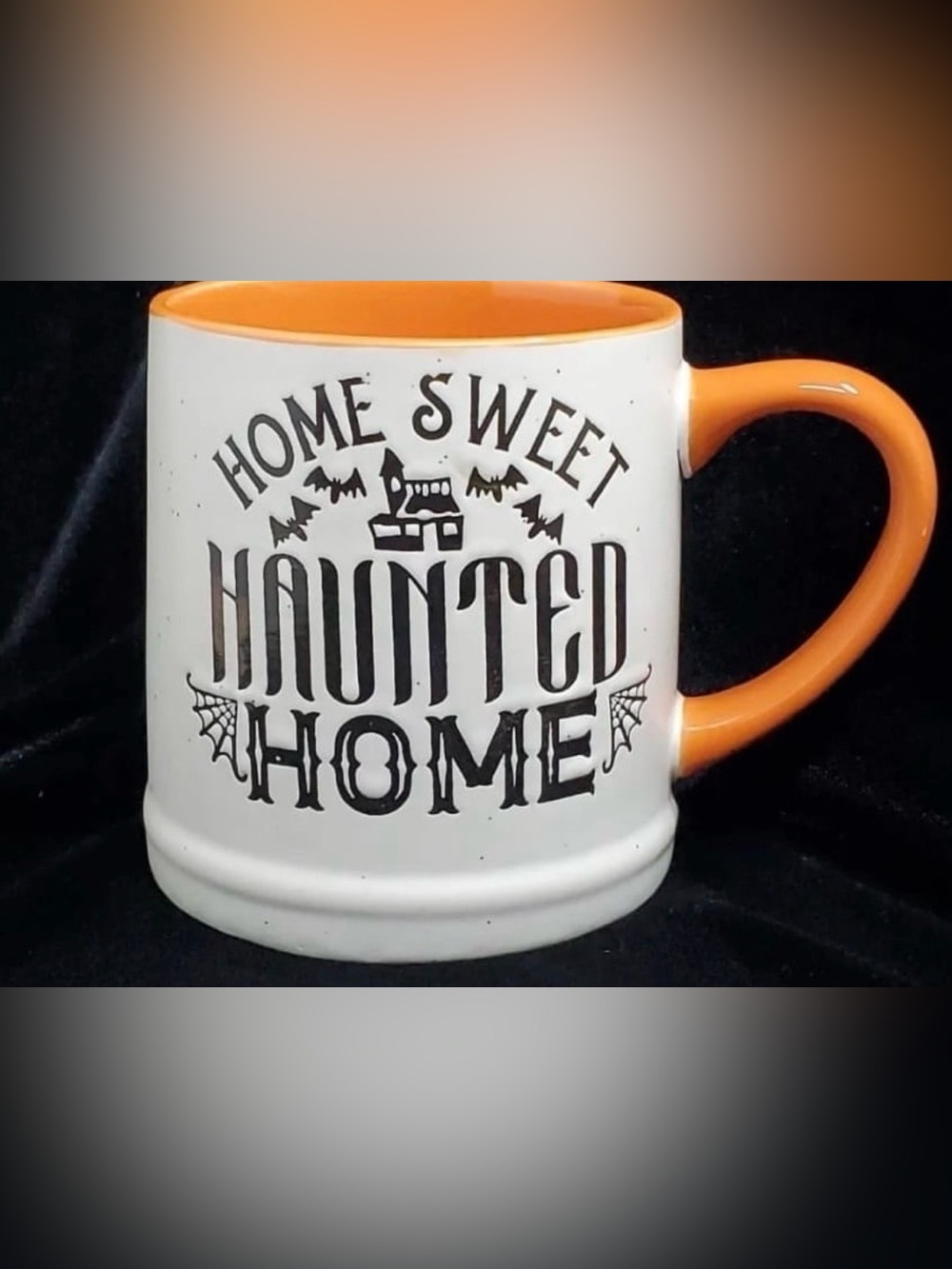 New Haunted Home Ceramic Coffee Mug - White with Orange Interior .